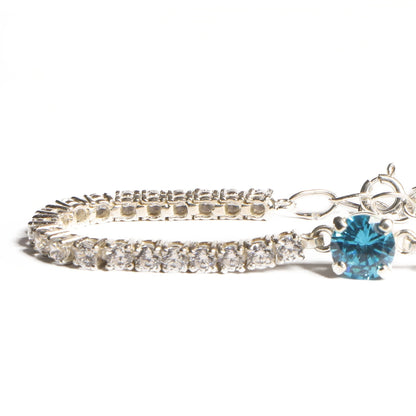 Elegant Silver Tennis Bracelet with Blue Crystal Centerpiece