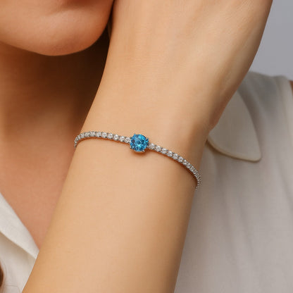 Elegant Silver Tennis Bracelet with Blue Crystal Centerpiece
